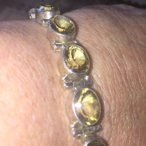 Yellow faceted stone and Sterling silver bracket